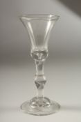 A GOOD GEORGIAN WINE GLASS with baluster stem.
