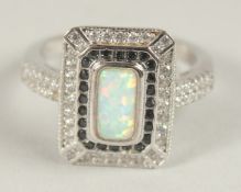 A SILVER OPAL ART DECO STYLE RING.