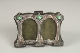 A MINIATURE SILVER DOUBLE PHOTOGRAPH FRAME. 8cms x 11cms.