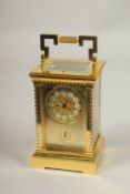 A GOOD GILT BRONZE REPEATING CARRIAGE CLOCK with alarm. 14cms high.