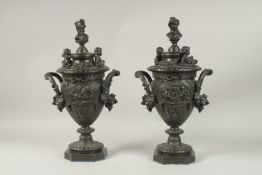 A VERY GOOD PAIR OF CLASSICAL BRONZE TWO-HANDLED URNS AND COVERS, with busts, putti, ribbons and