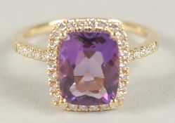 A HALLMARKED 18CT YELLOW GOLD, AMETHYST AND DIAMOND RING.
