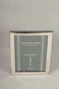 A HALLMARKED STERLING SILVER PHOTOGRAPH FRAME. 20cms x 15cms.