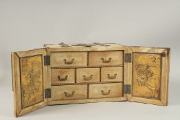 A 17TH CENTURY FAUX IVORY COVERED TABLE CASKET with brass mounts, the front with double panel doors,