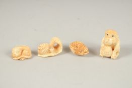FOUR CARVED BONE NETSUKES.
