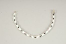 A SILVER OPAL AND SAPPHIRE LINE BRACELET.