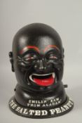A PAINTED CAST IRON PEANUT MAN