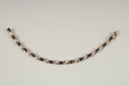 A 9CT GOLD, DIAMOND AND SAPPHIRE BRACELET.