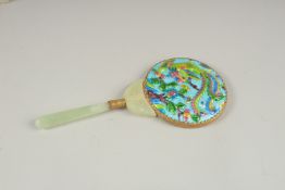 A MAGNIFYING GLASS with enamel back and jade enamel.