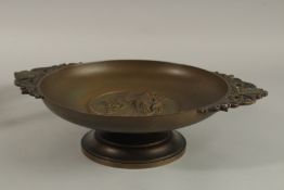 A LARGE 19H CENTURY CIRCULAR BRONZE TAZZA with pierced handles, flame to the centre. 27cms
