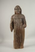 AN EARLY 16TH CENTURY CARVED WOOD STANDING SAINT. 76cms high.