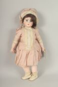 A JUMEAU, No. 10, BISQUE HEADED DOLL, articulated body, clothed. 60cms high.