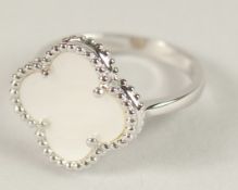 A SILVER AND MOTHER-OF-PEARL RING.