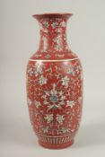 A CHINESE RED GROUND BLUE AND WHITE PORCELAIN VASE. 46cms high.