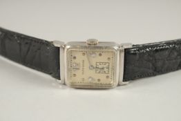 A MILTON GOLDEN PLATINUM AND DIAMOND WRISTWATCH.