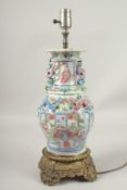 A GOOD CANTON PORCELAIN LAMP on a gilt base. Lamp: 30cms high.