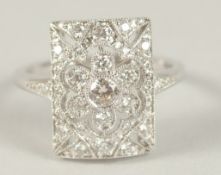 AN ART DECO STYLE HALLMARKED 18CT WHITE GOLD AND DIAMOND RING (.70cts).