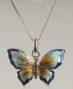 A STERLING SILVER AND ENAMEL BUTTERFLY PENDANT AND CHAIN.