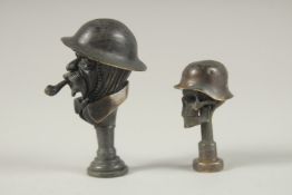 TWO REPLICA BRONZE WWI TAMPER SEALS.