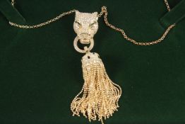 A SILVER AND GOLD PANTHER HEAD TASSEL NECKLACE.