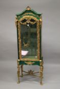 AN UNUSUAL FAUX MALACHITE AND ORMOLU MOUNTED VITRINE, with a single door enclosing two glass