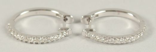 A PAIR OF HALLMARKED 18CT WHITE GOLD HOOP EARRINGS, set with diamond (.45cts).