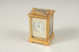A MINI BASS CARRIAGE CLOCK. 6cms high.