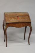 A FRENCH STYLE MARQUETRY INLAID AND ORMOLU MOUNTED KINGWOOD BUREAU DE DAME. 96cms high x 77cms