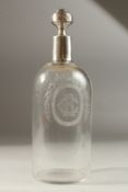 A GOOD CONTINENTAL GLASS DECANTER. engraved CR in a shell, with silver mount and stopper. 28cms