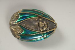 A BRASS AND ENAMEL BAT VESTA. 6cms.