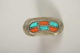 A TURQUOISE AND CORAL RING.