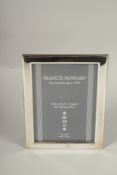 A HALLMARKED STERLING SILVER PHOTOGRAPH FRAME. 18cms x 13cms.