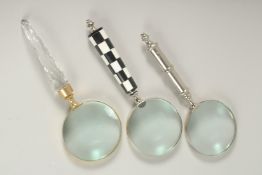 THREE VARIOUS MAGNIFYING GLASSES.