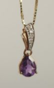 A 9CT YELLOW GOLD PEAR SHAPED AMETHYST PENDANT with diamond set bale on a gold-plated silver