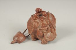 A LARGE JAPANESE CARVED HARDWOOD TURTLE INRO. Signed, with rope.