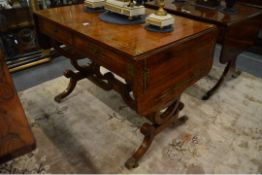 A VERY GOOD REGENCY ROSEWOOD AND BRASS INLAID SOFA TABLE,with folding flaps. 122cms long.