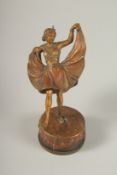 A GOOD 19TH CENTURY VIENNA BRONZE GIRL with lift-up skirt, on a circular base. 14cms high.