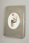AN ENGINE TURNED SILVER CIGARETTE CASE. Birmingham 1940, with a glamour model enamel.