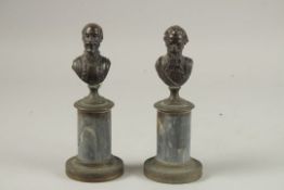 A PAIR OF GRAND TOUR BRONZE BUSTS of men on marble bases. 19cms high.