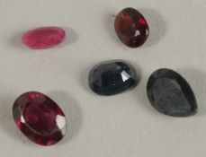 A PARCEL OF LOOSE GEMSTONES, including sapphire, ruby and garnet, boxed. Sapphires 1.47ct. Ruby 0.