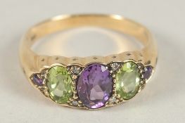 A 9CT GOLD PERIDOT, AMETHYST AND DIAMOND RING.