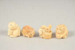 FOUR CARVED BONE NETSUKES.