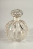 A NOUVEAU GLASS SCENT BOTTLE with silver top. 14cms high. Birmingham 1904.