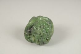 A CARVED JADE WALNUT.