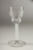A GEORGIAN WINE GLASS, the bowl engraved with roses, with air twist stem. 15cms high, tiny chip to