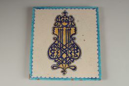 A FINE AND UNUSUAL 19TH CENTURY NORTH INDIAN MULTAN GLAZED POTTERY TILE, depicting stylised Arabic