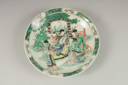 A CHINESE FAMILLE VERTE PORCELAIN DISH, decorated with female figures playing instruments, the