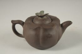 A CHINESE YIXING TEAPOT, with butterfly finial, impressed mark to inner lid and base.