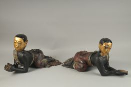 A PAIR OF LARGE CARVED AND LACQUERED WOOD CRAWLING BUDDHAS, each with gilded faces and coloured