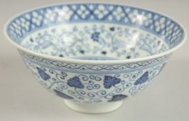 A FINE CHINESE BLUE AND WHITE PORCELAIN BOWL, with various decorative scrolling floral motifs, the